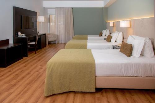 Habitación Triple del hotel Covilha Dona Maria Affiliated By Melia. Foto 1