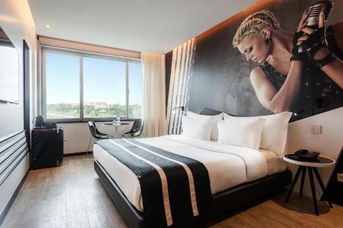 Habitación Melody - Cama extragrande del hotel Hf Fénix Music. Foto 1