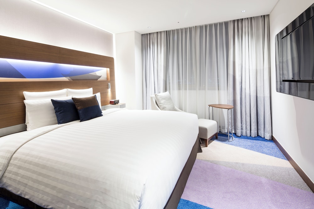 Junior Suite con 1 Cama King Size del hotel Novotel Ambassador Suwon. Foto 3
