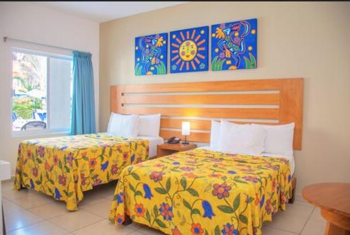 Habitación Estándar - 2 camas dobles del hotel Decameron Los Cocos Guayabitos, Ramada All-Inclusive Resort. Foto 2
