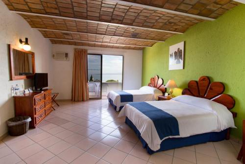 Habitación Estándar - 2 camas dobles del hotel Decameron Los Cocos Guayabitos, Ramada All-Inclusive Resort. Foto 3