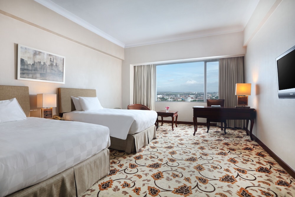 Habitación Deluxe, 2 camas individuales del hotel Grand Mercure Medan Angkasa. Foto 1