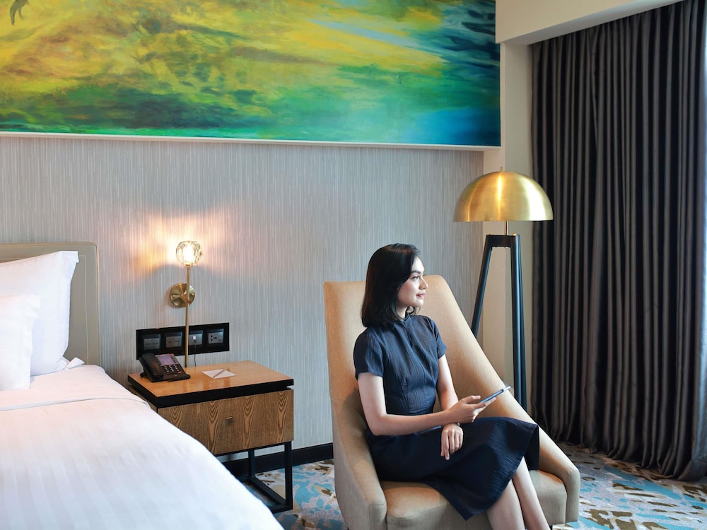 Habitación ejecutiva, 2 camas individuales del hotel Grand Mercure Medan Angkasa. Foto 1