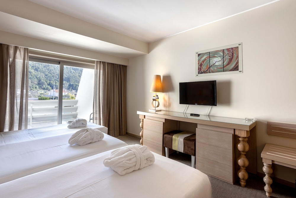 Habitación Triple Estándar del hotel Porta Do Sol Conference Center and Spa. Foto 4