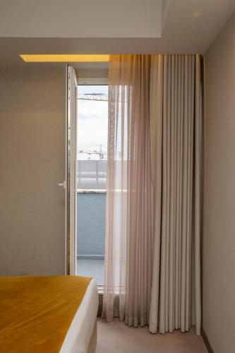 Habitación Doble Superior con terraza - 1 o 2 camas del hotel WOT Porto. Foto 1