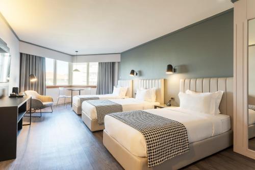 Habitación Triple Confort del hotel Hf Fénix Porto. Foto 9
