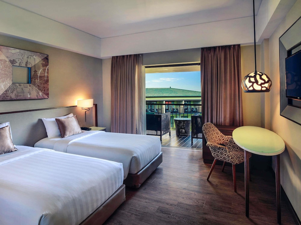 Habitación Deluxe, Balcón - 2 Camas Individuales del hotel Mercure Bali Legian. Foto 8