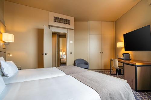 Habitación Familiar Confort Plus del hotel Dom Henrique Downtown. Foto 1