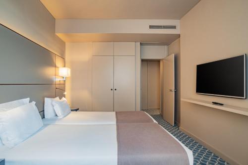 Habitación Familiar Confort del hotel Dom Henrique Downtown. Foto 2