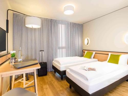 Estudio con camas individuales del hotel Adagio Access München City Olympiapark. Foto 5