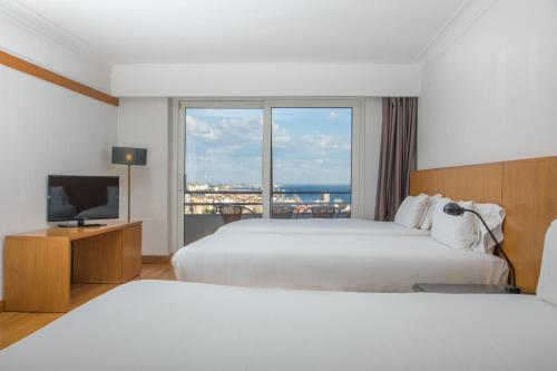 Habitación Cuádruple con vistas al mar del hotel Bandb Sado Setúbal. Foto 1