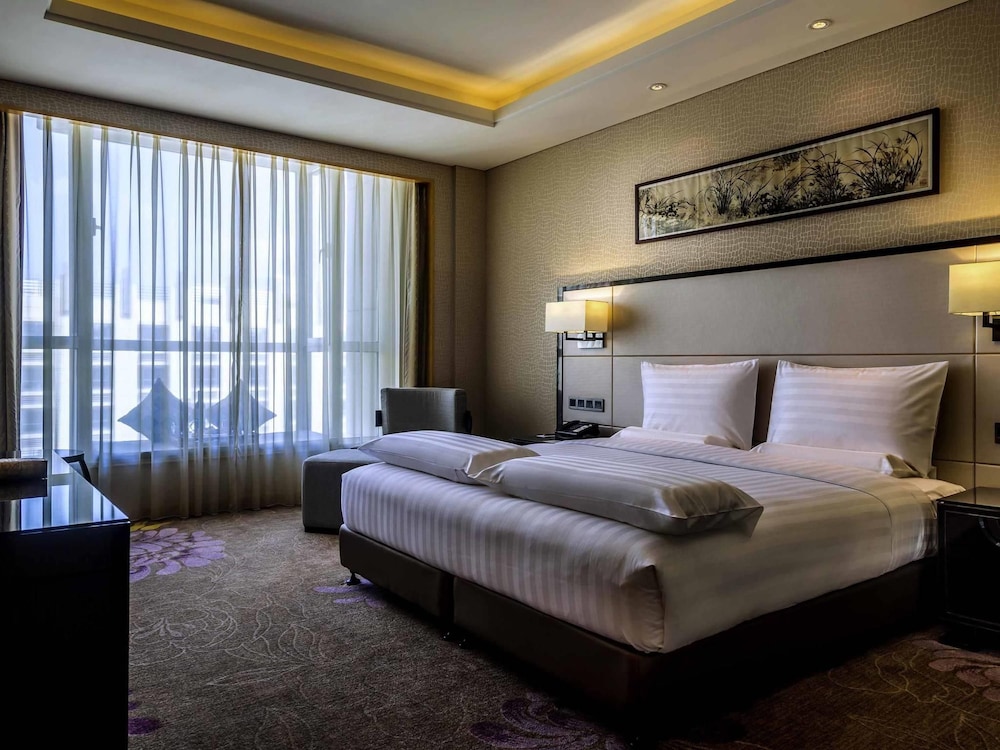 Suite ejecutiva, 1 cama de matrimonio grande, Acceso al salón del club del hotel Pullman Qingdao Ziyue