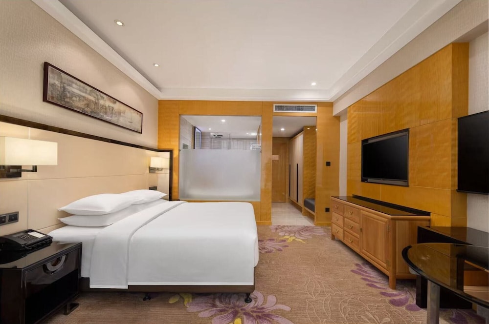 Habitación Deluxe, 1 cama de matrimonio grande del hotel Pullman Qingdao Ziyue. Foto 3