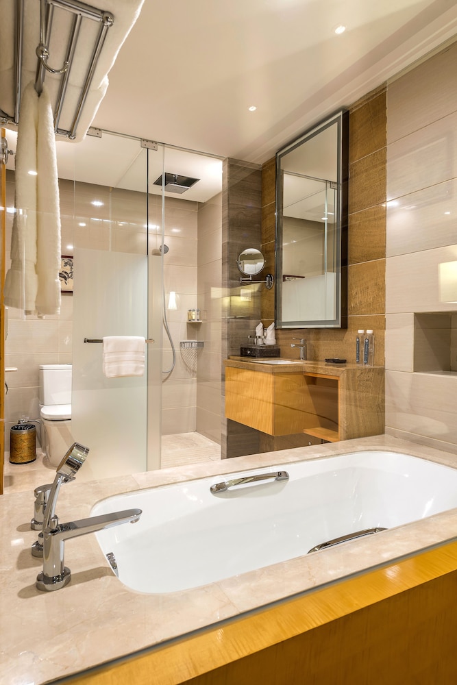 Habitación Deluxe, 1 cama de matrimonio grande del hotel Pullman Qingdao Ziyue. Foto 5