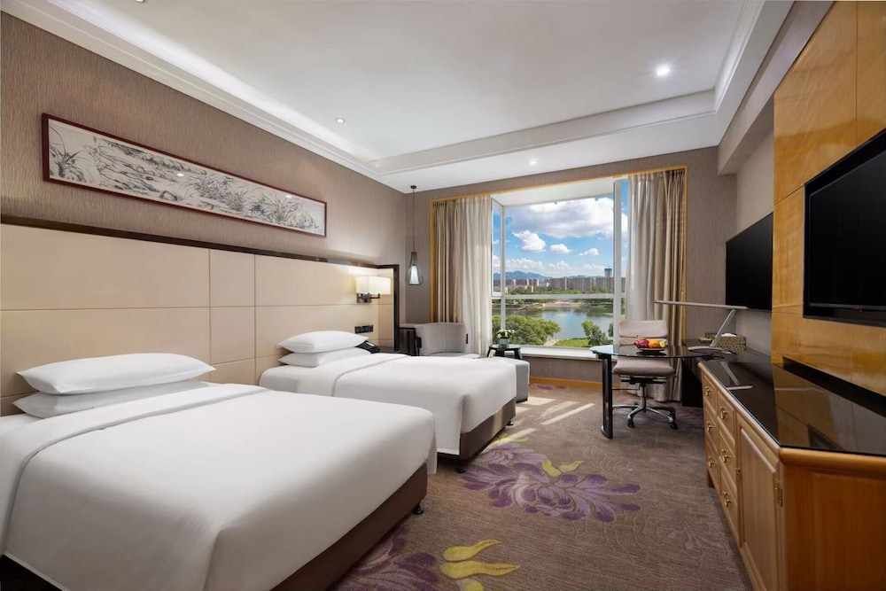 Habitación Deluxe, 2 camas individuales del hotel Pullman Qingdao Ziyue. Foto 1