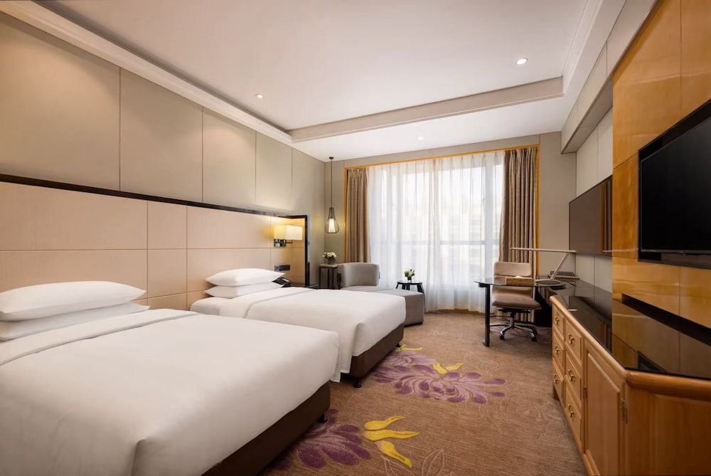 Habitación Deluxe, 2 camas individuales del hotel Pullman Qingdao Ziyue. Foto 2
