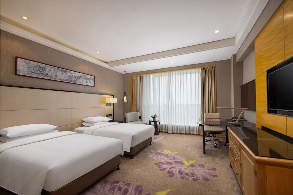 Habitación superior, 2 camas individuales del hotel Pullman Qingdao Ziyue. Foto 3