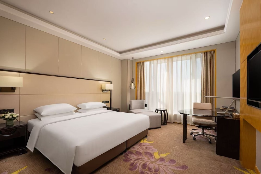 Habitación Deluxe, 1 cama de matrimonio grande, Acceso al salón del club (Executive) del hotel Pullman Qingdao Ziyue. Foto 2