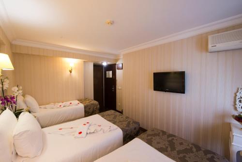 Habitación Triple del hotel Golden Horn - Special Class. Foto 7