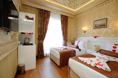Habitación Doble Deluxe - 1 o 2 camas del hotel Golden Horn - Special Class. Foto 1