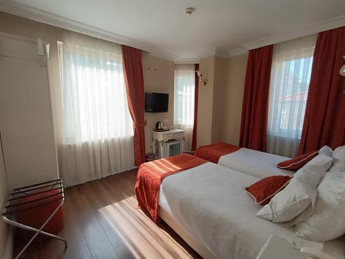 Habitación Doble con cama supletoria - 1 o 2 camas del hotel Golden Horn - Special Class. Foto 7