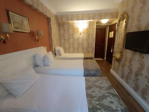 HABITACIÓN FAMILIAR COMUNICADA del hotel Golden Horn - Special Class. Foto 3