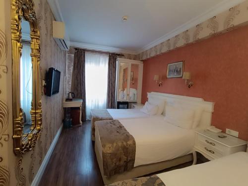 HABITACIÓN FAMILIAR COMUNICADA del hotel Golden Horn - Special Class. Foto 6