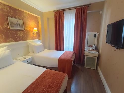 HABITACIÓN FAMILIAR COMUNICADA del hotel Golden Horn - Special Class. Foto 8
