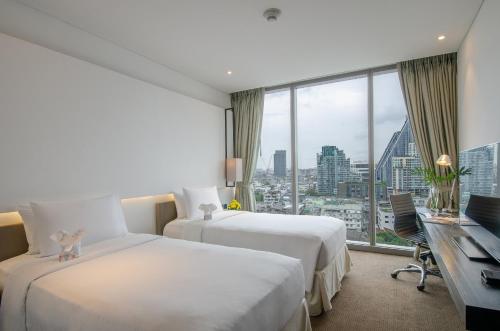 Habitación Doble Deluxe - 2 camas del hotel Amara Bangkok - Sha Plus. Foto 4