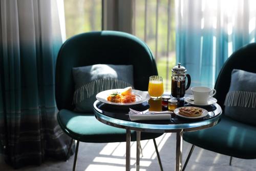 Habitación con vistas al parque del hotel The Athenaeum and Residences. Foto 3