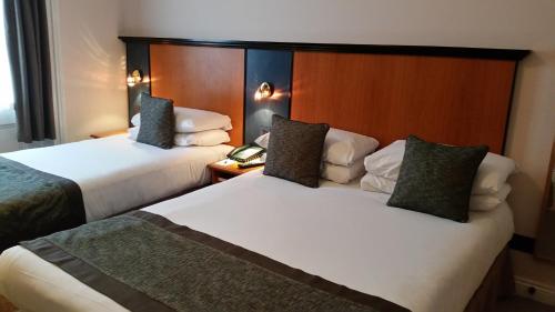 Habitación familiar - cama doble e individuales del hotel Best Western Corona. Foto 9