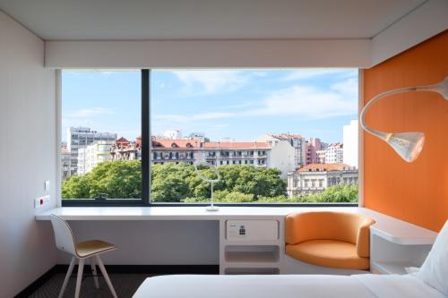 Habitación Doble Deluxe con vistas a la ciudad - 1 o 2 camas del hotel Evolution Lisboa. Foto 1