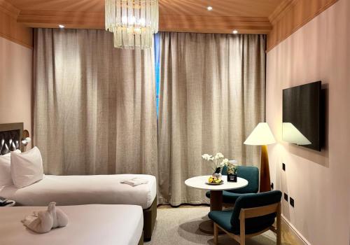 Double Family Room with Single Bed del hotel Doubletree By Hilton London Marble Arch. Foto 2