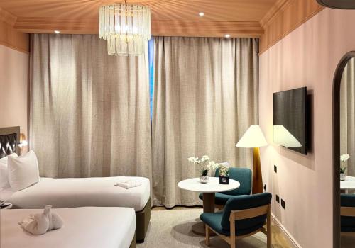 Double Family Room with Single Bed del hotel Doubletree By Hilton London Marble Arch. Foto 3