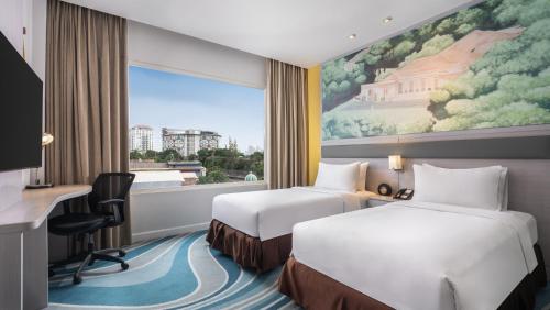 Habitación Doble Privilege - 2 camas del hotel Mercure Jakarta Cikini. Foto 4