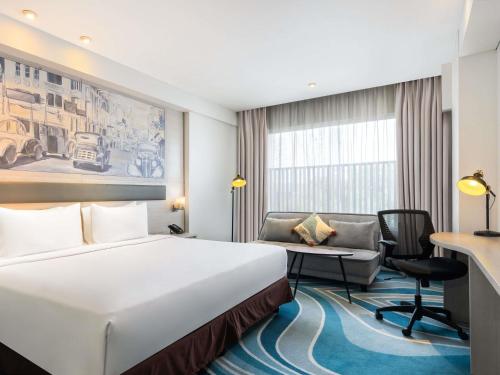 Habitación Deluxe del hotel Mercure Jakarta Cikini. Foto 1