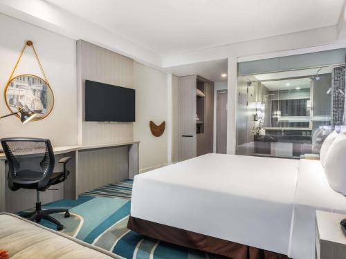 Habitación Deluxe del hotel Mercure Jakarta Cikini. Foto 4
