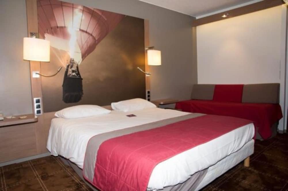 Habitación Classic - Una cama doble y un sofá cama para un niño del hotel Mercure Vienne Sud Chanas. Foto 9