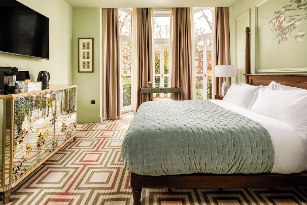 Suite Lujo 1 Cama queen del hotel Ellen Kensington. Foto 1