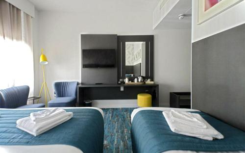 Habitación Triple del hotel K Kensington. Foto 1