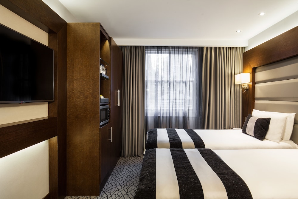Habitación Deluxe con 2 camas individuales del hotel Park Grand Paddington Court. Foto 1