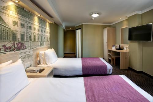 Habitación Doble con cama supletoria - 2 camas del hotel President. Foto 1