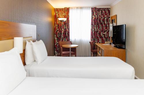 Habitación Doble - 2 camas del hotel Hilton London Olympia. Foto 1