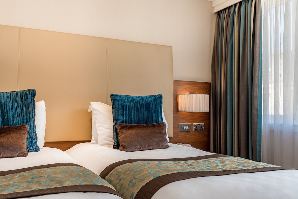 Habitación Deluxe con 2 camas individuales del hotel Thistle London Marble Arch. Foto 3