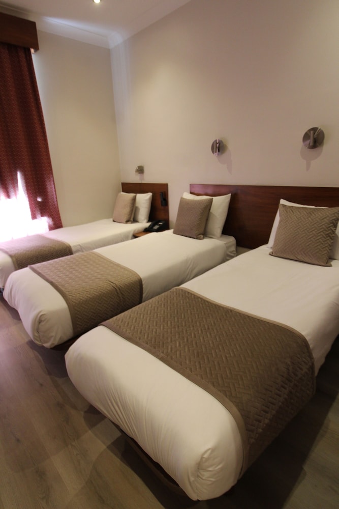 Habitación triple del hotel Wedgewood. Foto 5