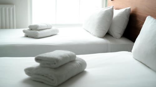 Habitación Triple Premium del hotel Chelsea Guest House. Foto 10