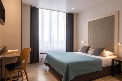 Habitación Doble del hotel Central Paris. Foto 4