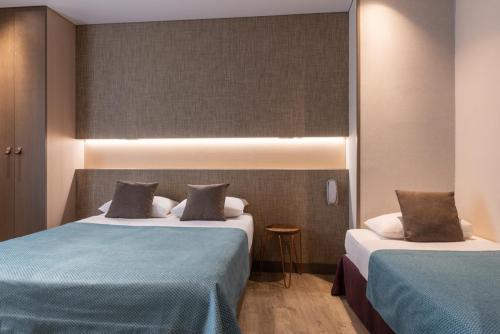 Habitación Triple del hotel Central Paris. Foto 2