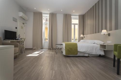 Habitación Cuádruple Prémium del hotel San Lorenzo Boutique. Foto 1