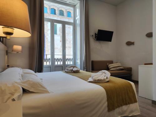 Habitación Doble Clásica con vistas a la ciudad del hotel San Lorenzo Boutique. Foto 9